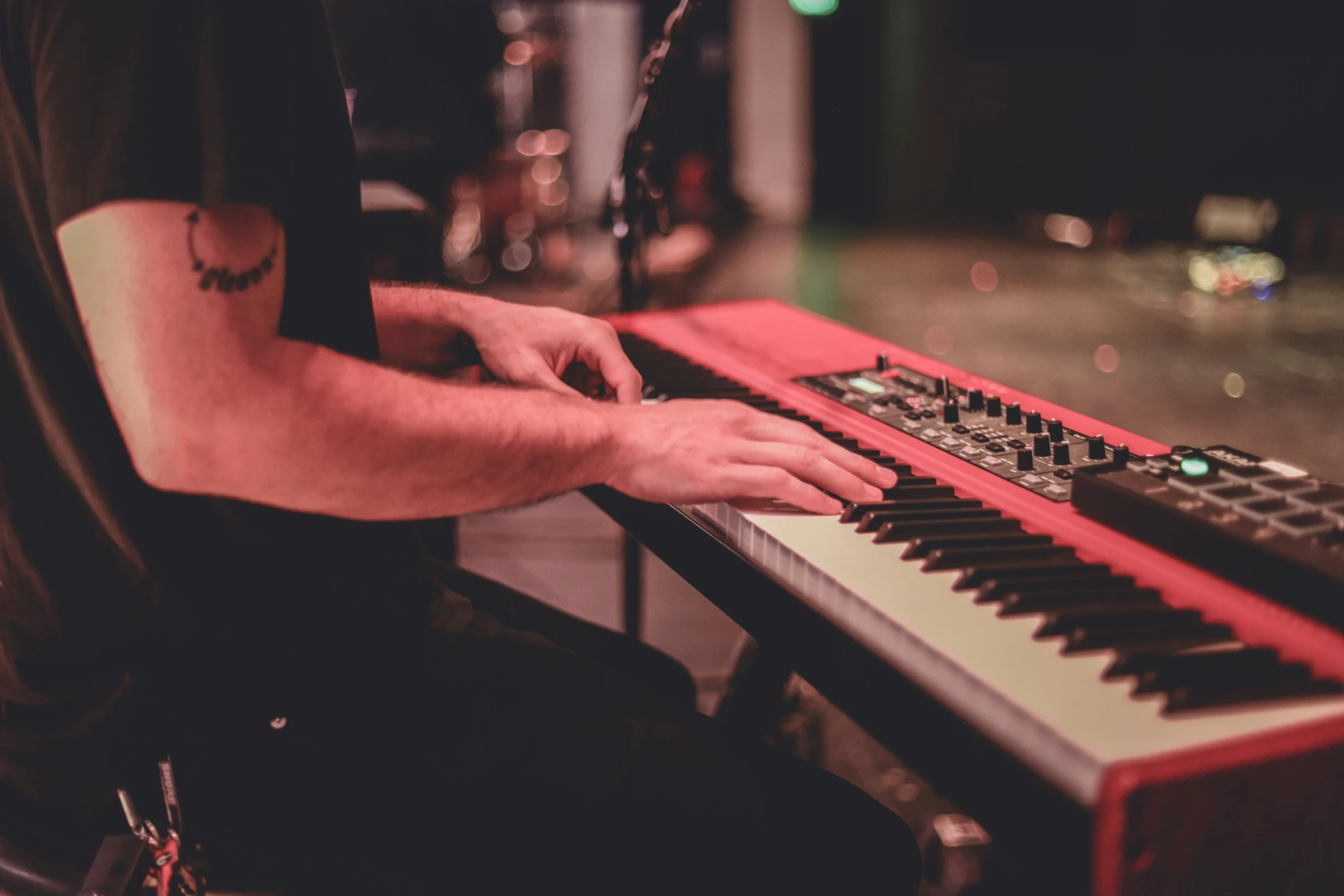 the keyboard that a man is playing on