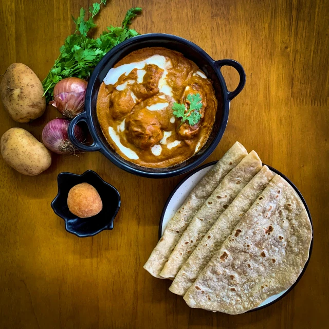 an image of indian food with potatoes and vegetables