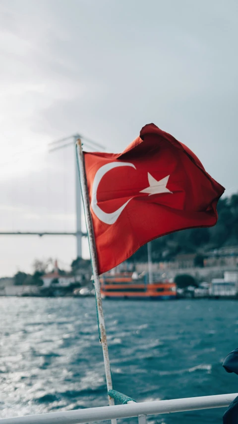 a flag on the back of a boat