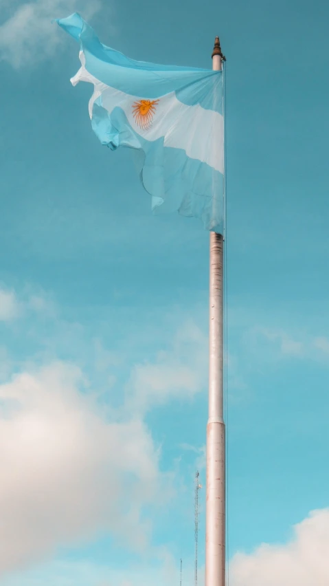 the flag is in the top of the flag pole