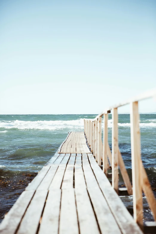 a large body of water sitting over a pier