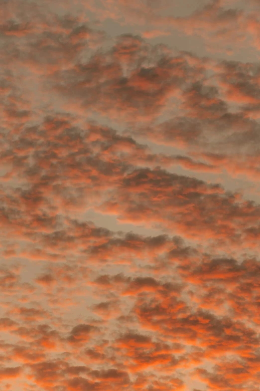 an airplane is flying through a cloudy sky