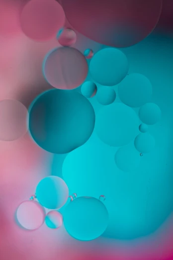 an abstract po of circles and bubbles against a blue pink background