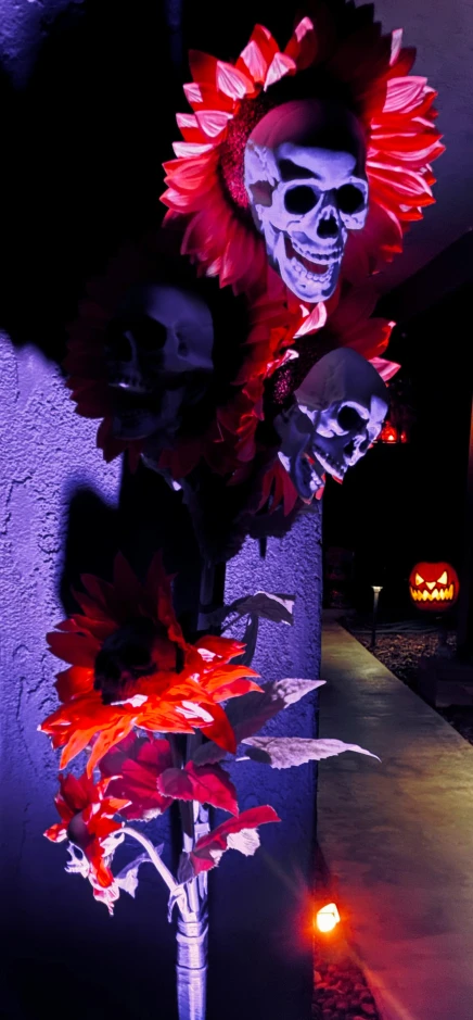 a decorated display with skulls and flowers