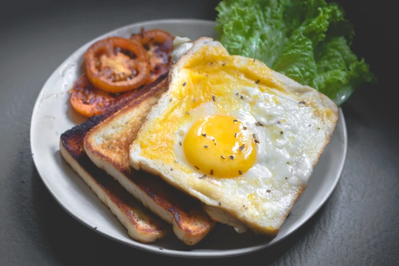 a plate topped with three pieces of toast and an egg