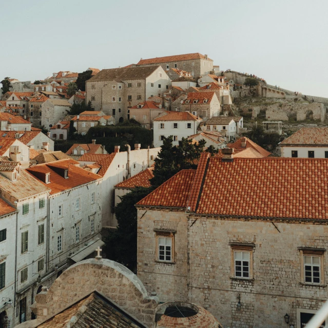 a city with rooftops and small houses