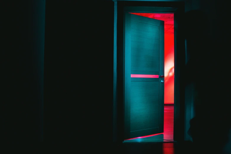 an open doorway with red light inside of it