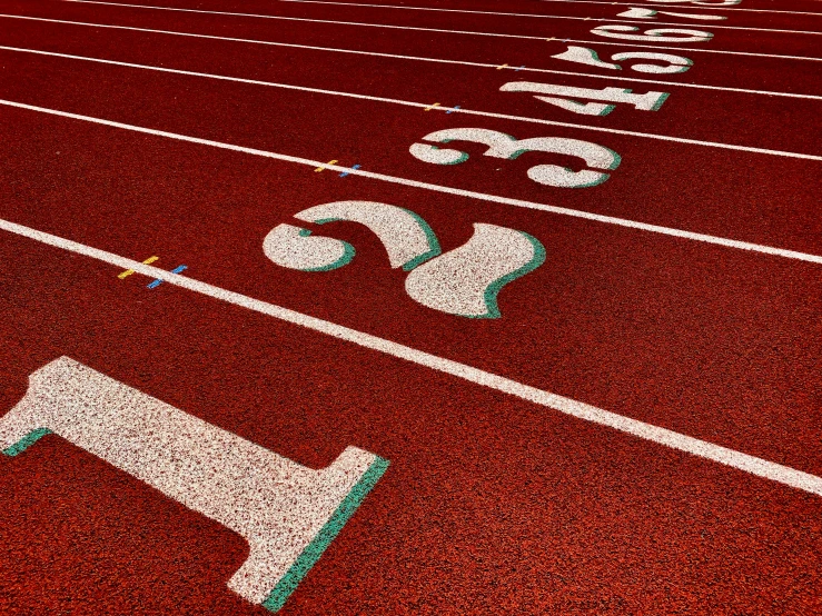 an athletic field with numbers painted on it