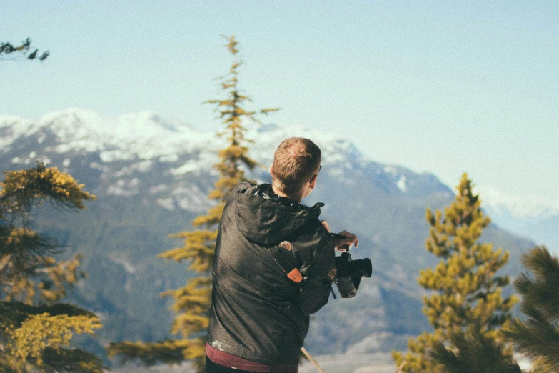 a man taking a picture from high up in the sky