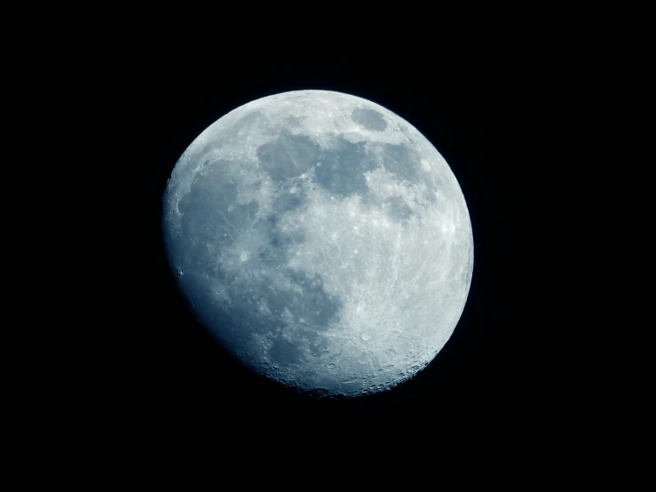 the moon in the dark sky is visible