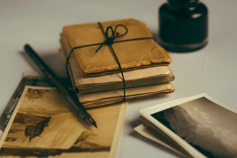 three old books sitting next to each other on a table