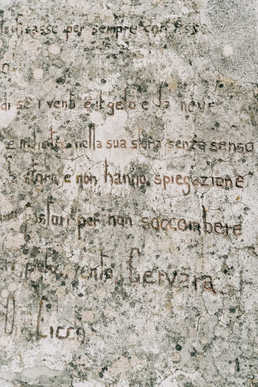 a stone with writings and writing painted on it