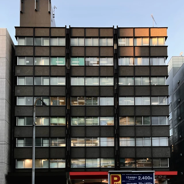 a very tall black building with lots of windows