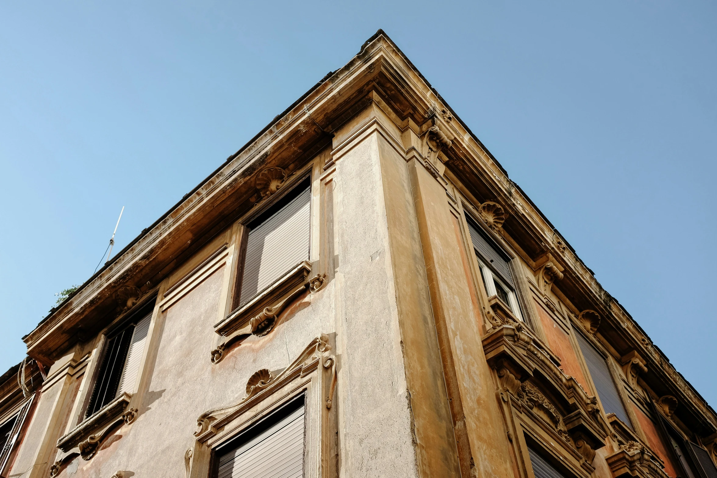 view up at an old building with a window on top