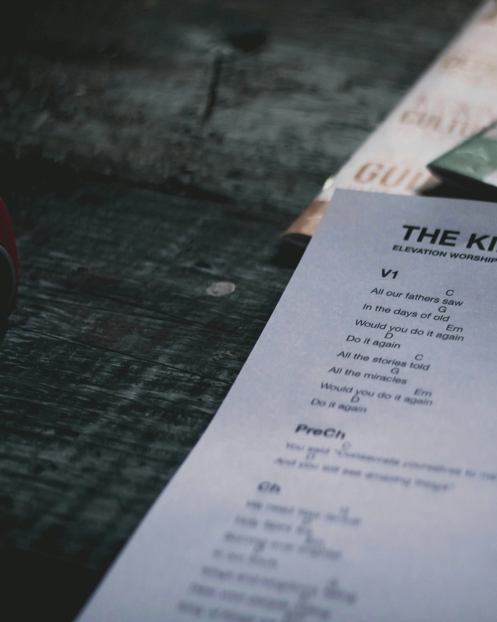 an empty menu sitting on top of a wooden table