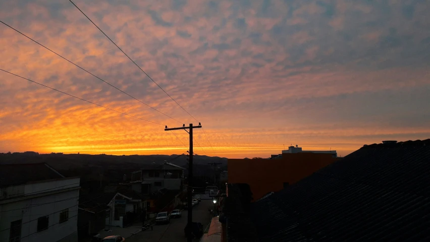 a sunset view from the roof of a house