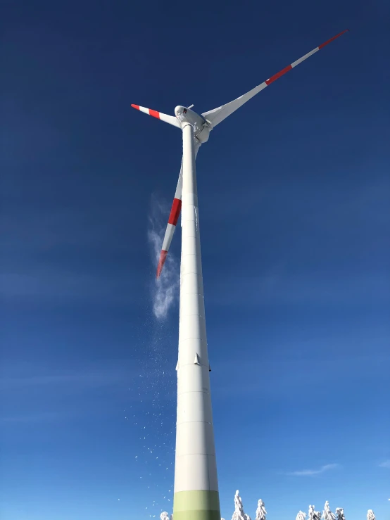 a wind turbine blows out smoke as it travels through the air