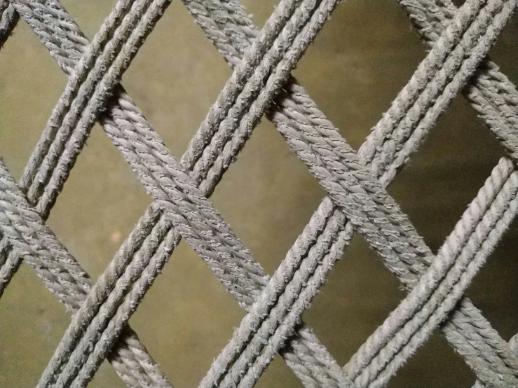 a close up image of a chain link fence