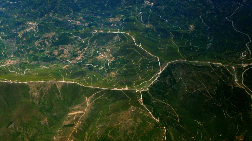 an aerial s of a winding mountain road