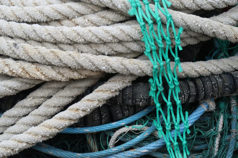 a group of ropes stacked together next to each other