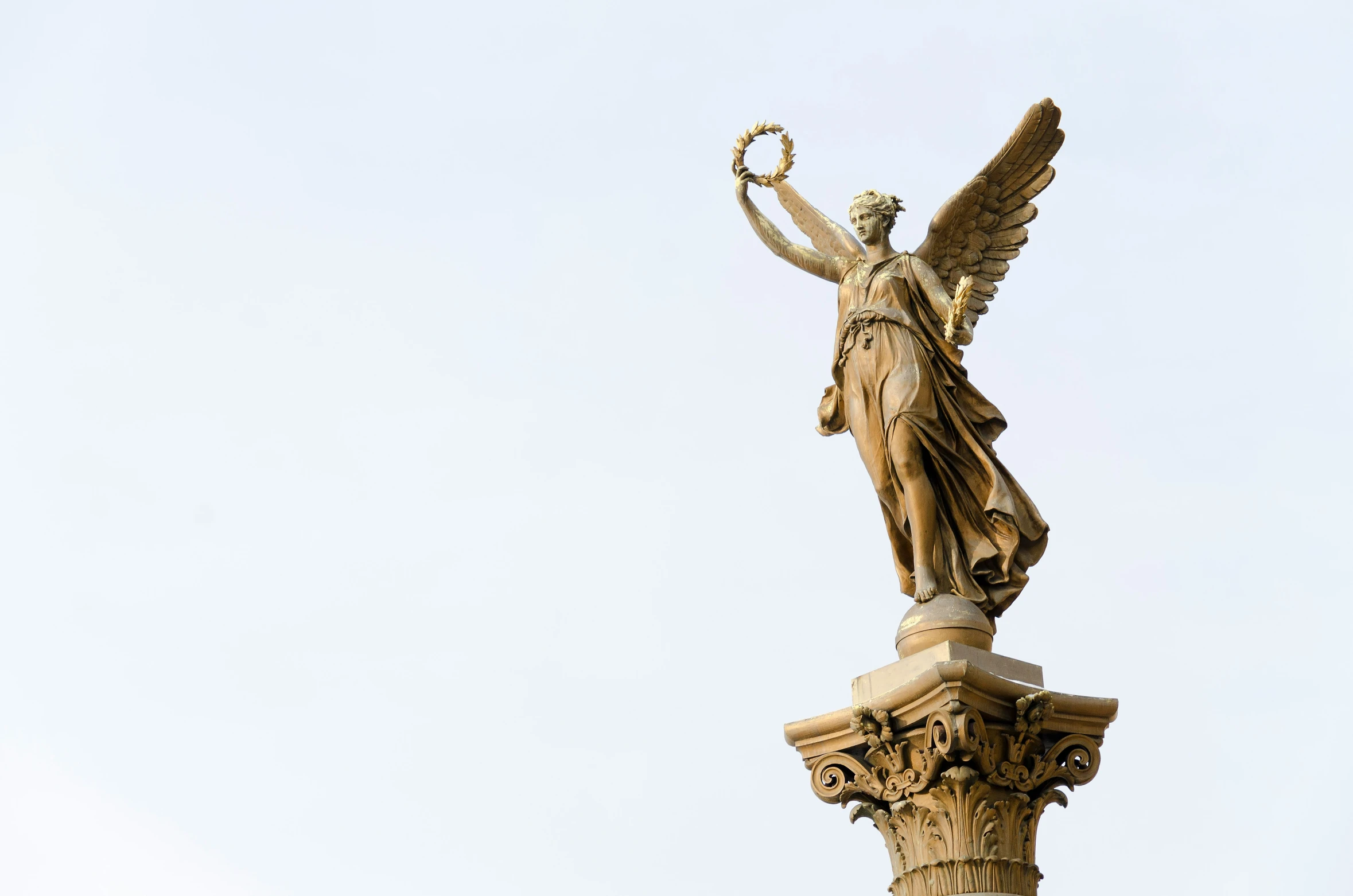 a view of the statue of liberty atop the column