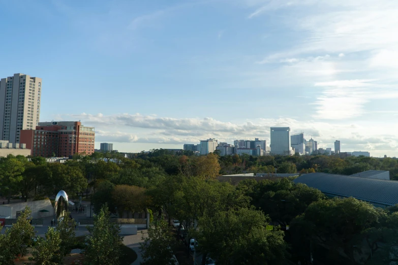 some buildings and trees are in the foreground