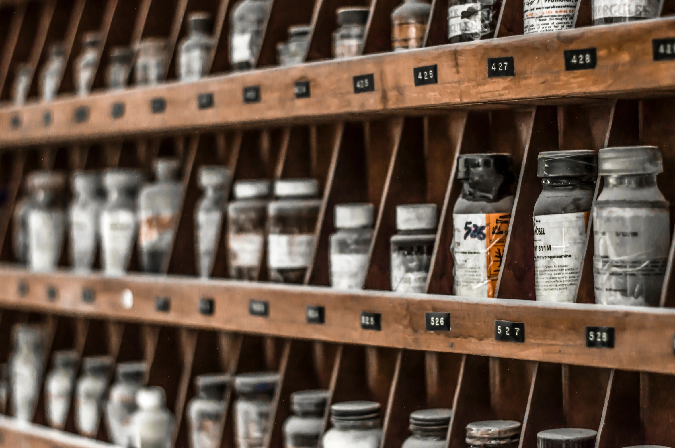 a shelf filled with lots of assorted types of juice