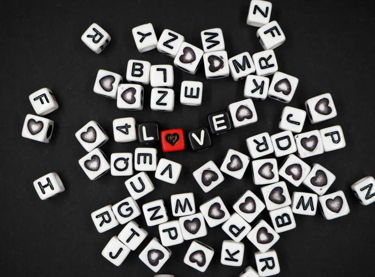 several letter and shape blocks with the words love written in it
