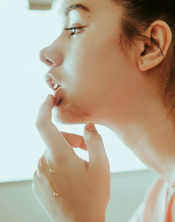 a woman with a ring is looking away