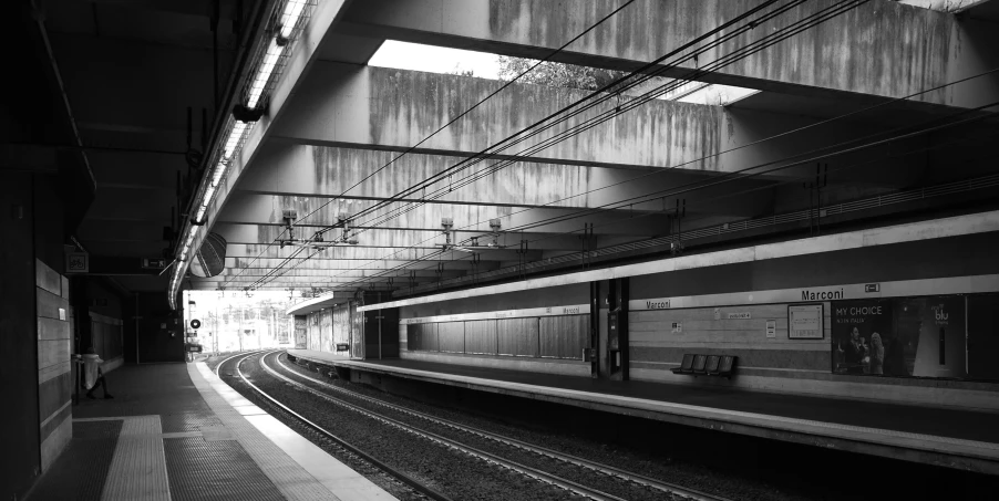 a train station with a very long line of tracks