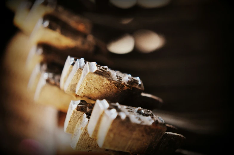 several pastry shaped like gears in a line on a shelf