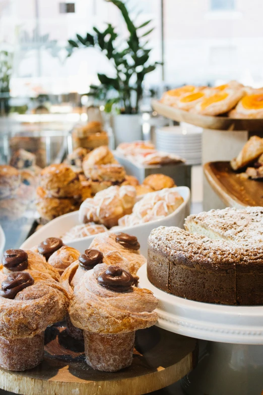 various baked goods displayed on plates on a table