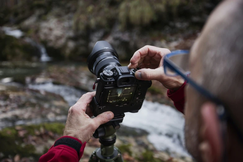 a man is recording a stream with his camera