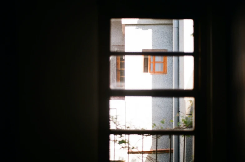 the view from inside of a window into another room