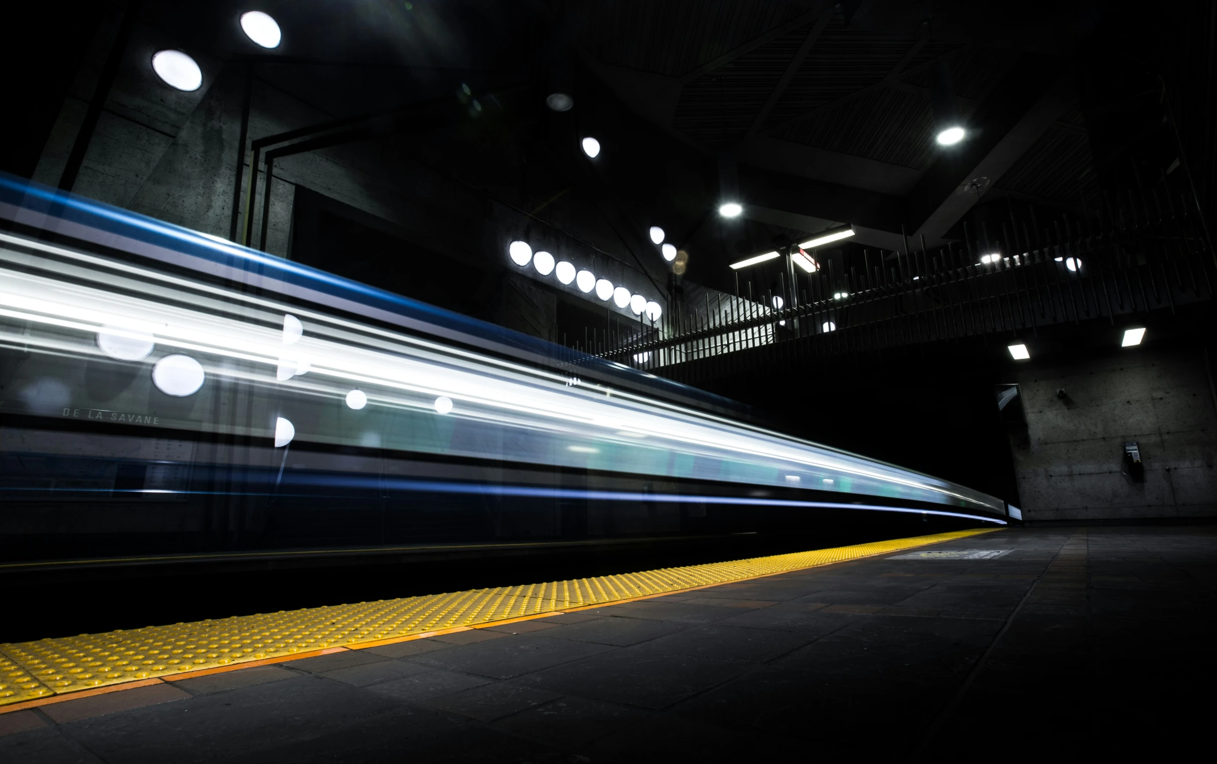 a light rail is passing in the dark