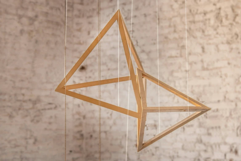 a modern style metal mobile has been designed using geometric elements
