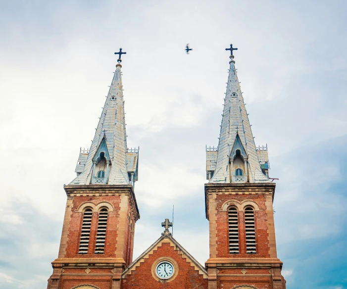 two steeples that are in front of a building