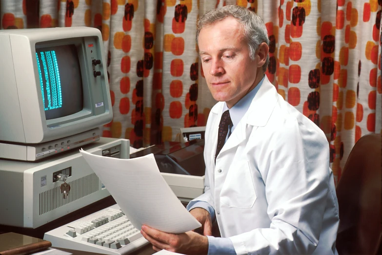 a man in white is reading an information document