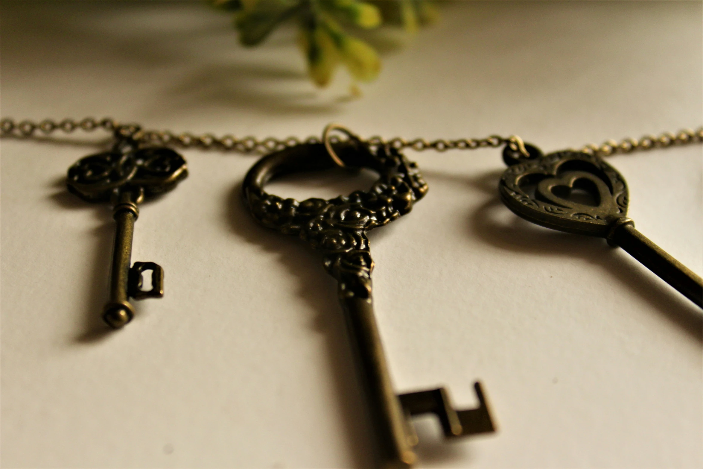 a close up of many antique keys on a chain