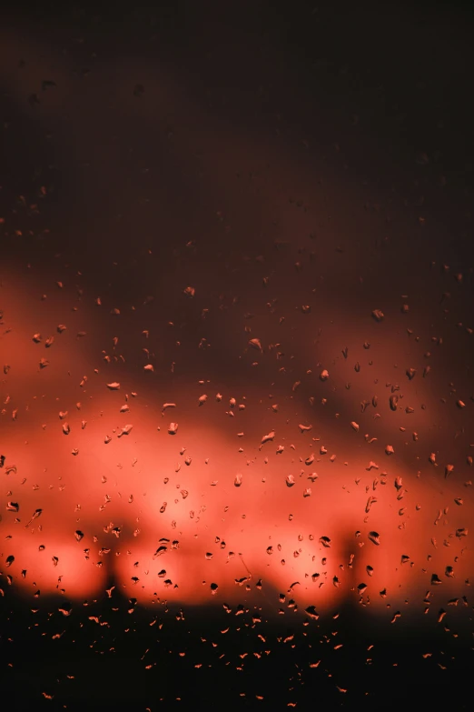 this po shows the window of a plane during a rain - drop