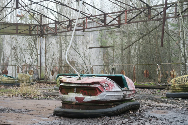 an abandoned building in the woods filled with trees