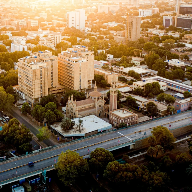 an aerial view of city buildings and a train track