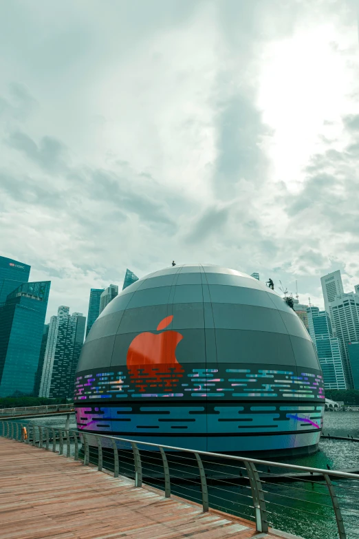 an artisticly designed apple logo on the side of a large building