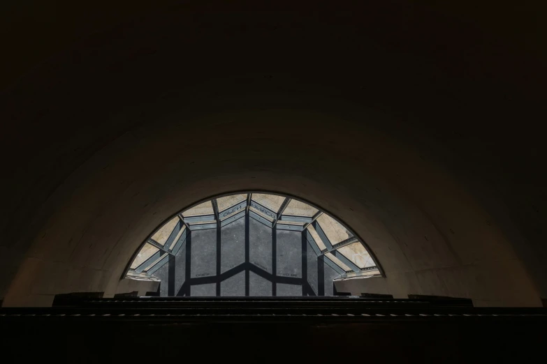 an arched window that appears to have a very dark background