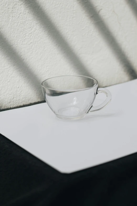 the reflection of a cup on a table