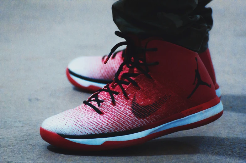 a close up of a person's sneakers on the court