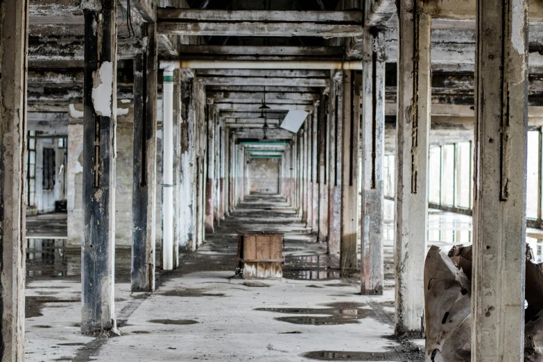 a long hallway with multiple doors between two structures