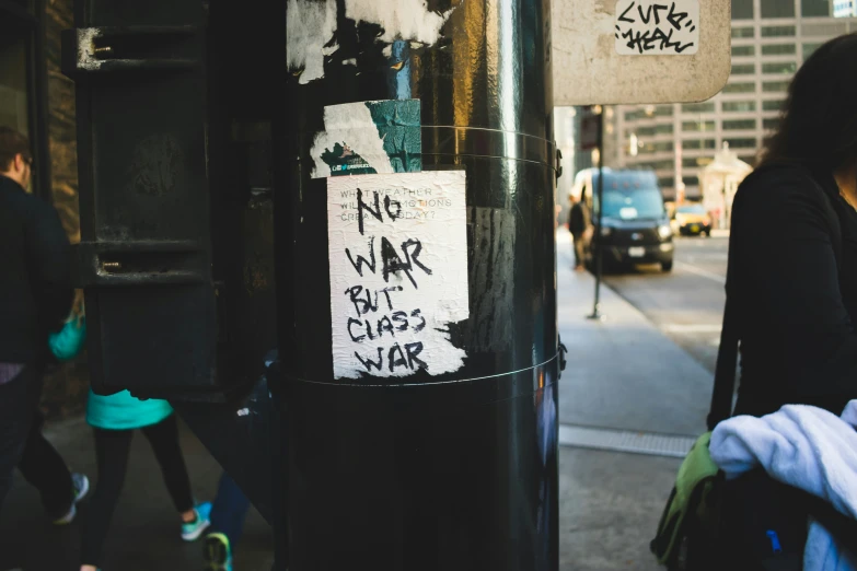 the word war is written on a black pole