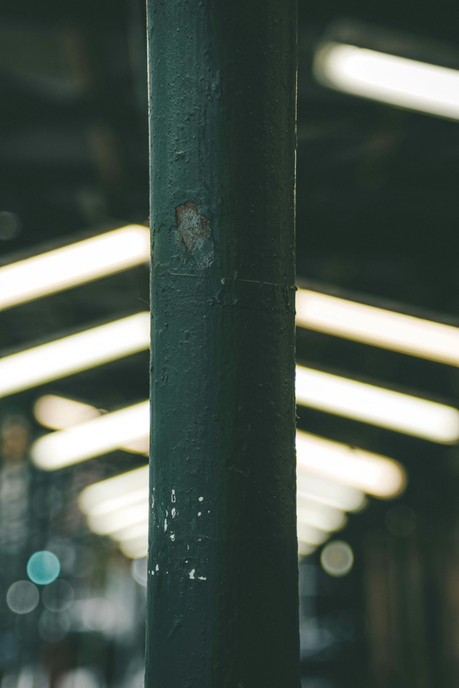 closeup of the top of a pole at a train station