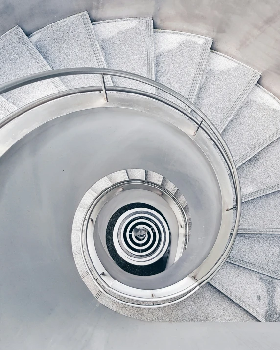 a large spiral stair is pographed from the inside